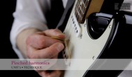 Teaching guitar students pinched harmonics